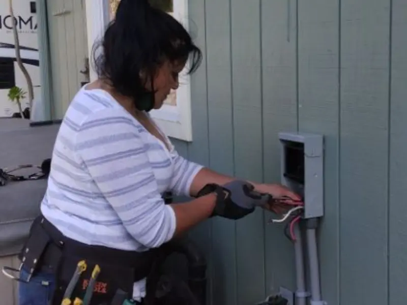 Licensed electrician wiring an exterior subpanel in Stayton